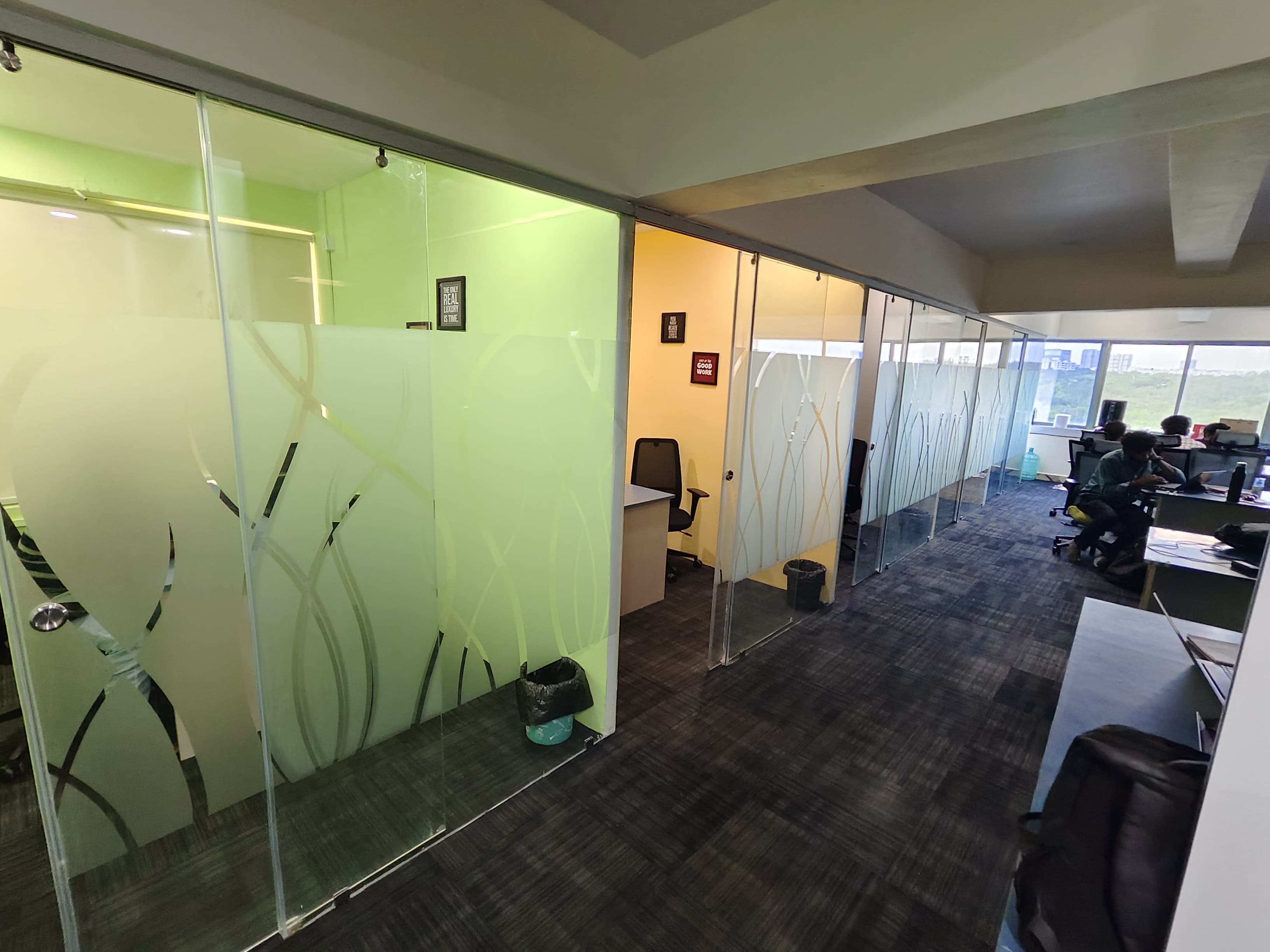 Slashnsap office hallway with garden-view windows